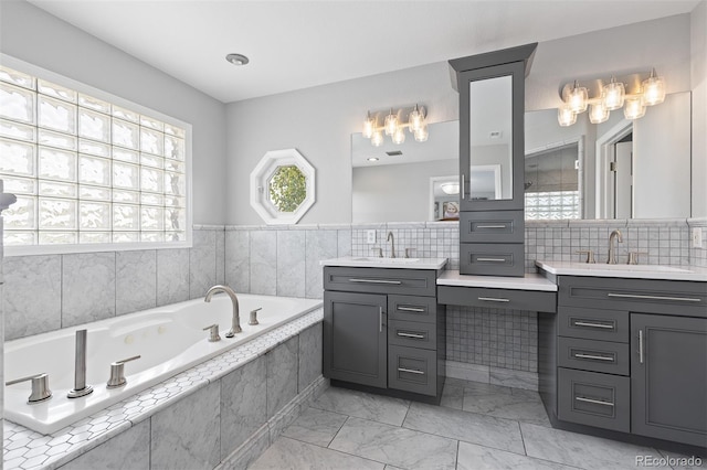 2370 W 152nd Ave, Broomfield, CO 80023 - bathroom featuring vanity, a bath, and marble look tile flooring