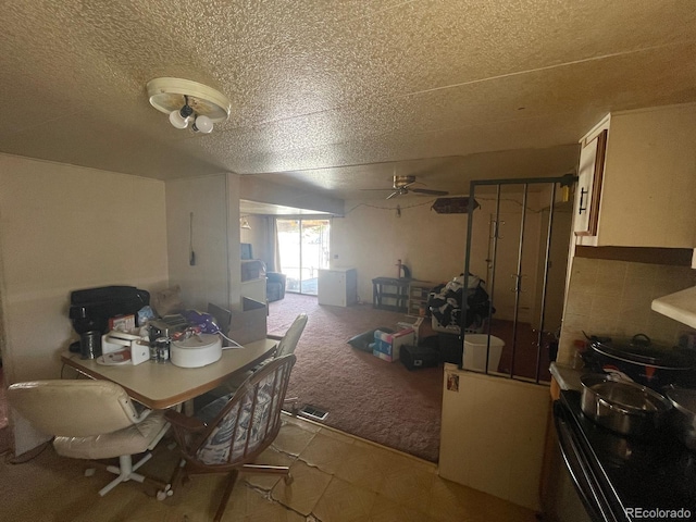 189 13th Ave, Cedaredge, CO 81413 - dining room featuring light colored carpet, a textured ceiling, and ceiling fan