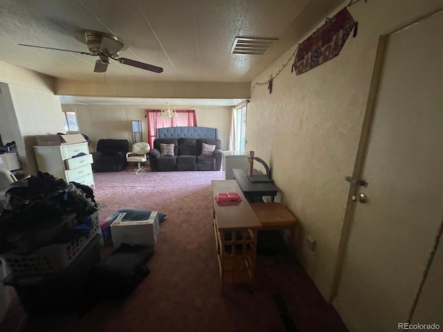 189 13th Ave, Cedaredge, CO 81413 - living room with visible vents, carpet floors, a textured wall, a textured ceiling, and a ceiling fan