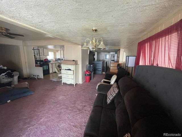 189 13th Ave, Cedaredge, CO 81413 - living room with ceiling fan with notable chandelier, a textured ceiling, and carpet