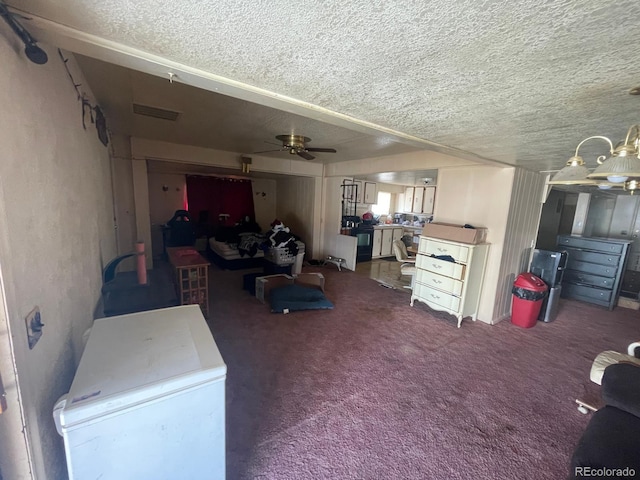 189 13th Ave, Cedaredge, CO 81413 - living room with a ceiling fan, visible vents, carpet floors, and a textured ceiling
