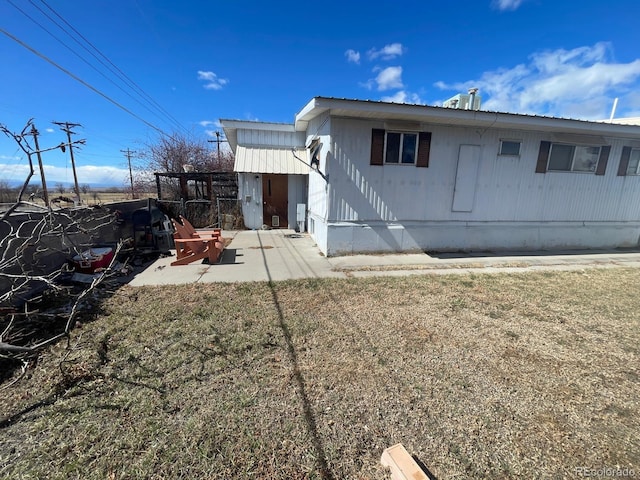189 13th Ave, Cedaredge, CO 81413 - back of house with a yard and a patio
