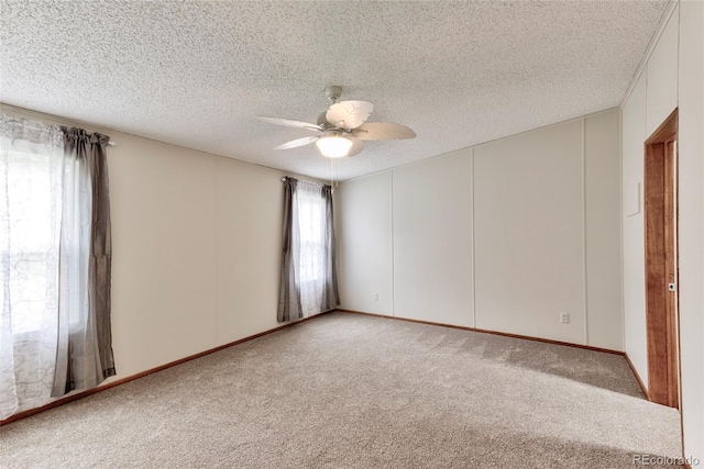 910 W Main St, Buena Vista, CO 81211 - spare room featuring ceiling fan, light colored carpet, and a textured ceiling