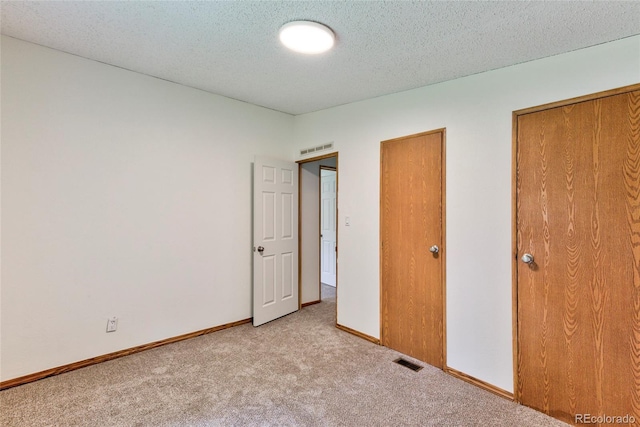 910 W Main St, Buena Vista, CO 81211 - unfurnished bedroom with light colored carpet and a textured ceiling