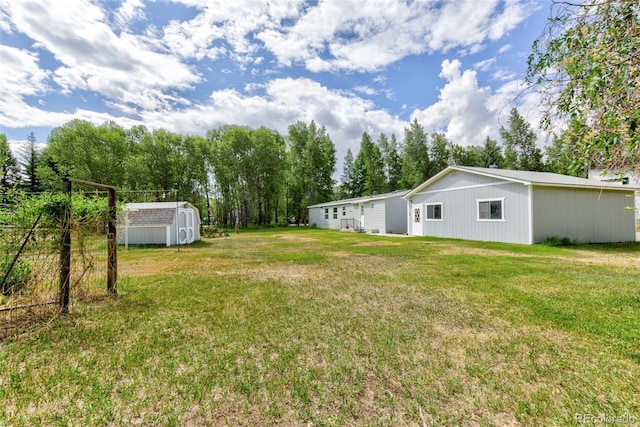 910 W Main St, Buena Vista, CO 81211 - view of grassy yard with a storage shed