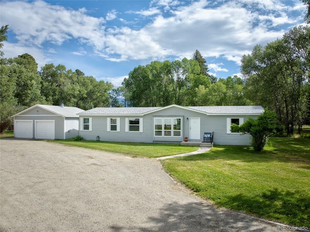910 W Main St, Buena Vista, CO 81211 - view of front of property with a detached garage and a front yard