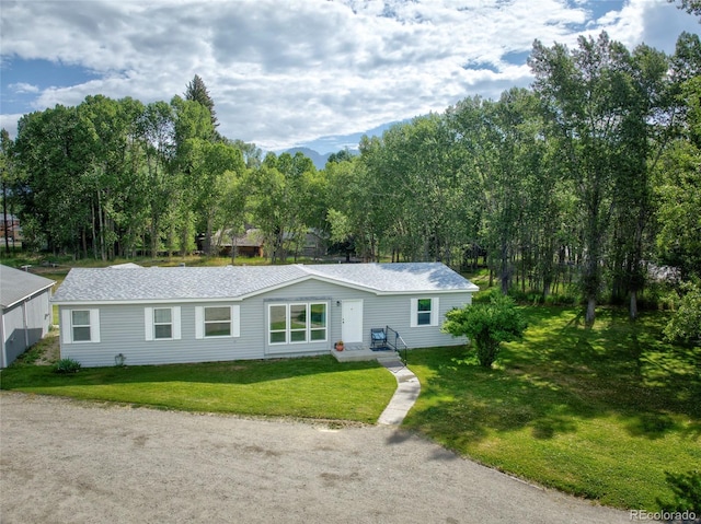 910 W Main St, Buena Vista, CO 81211 - ranch-style house featuring a front lawn