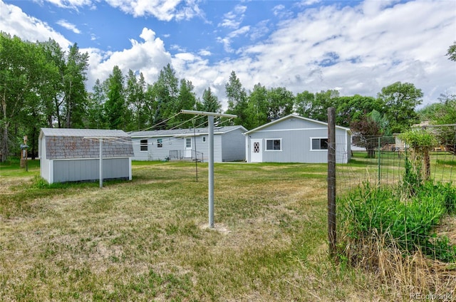 910 W Main St, Buena Vista, CO 81211 - view of yard featuring view of wooded area and a shed