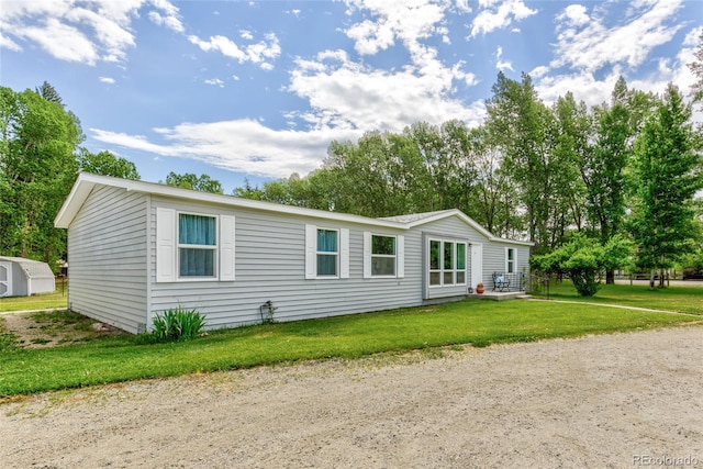 910 W Main St, Buena Vista, CO 81211 - manufactured / mobile home featuring a front lawn