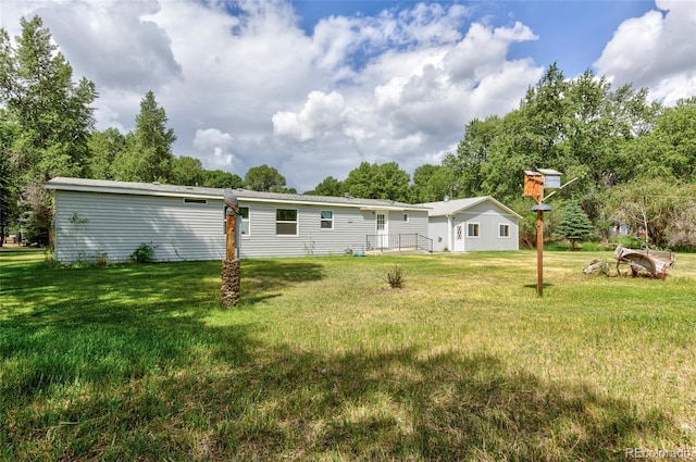 910 W Main St, Buena Vista, CO 81211 - rear view of property featuring a lawn