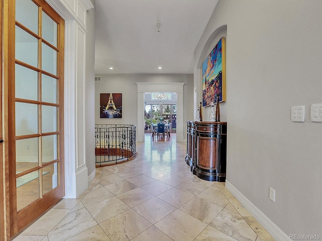 corridor with light tile floors