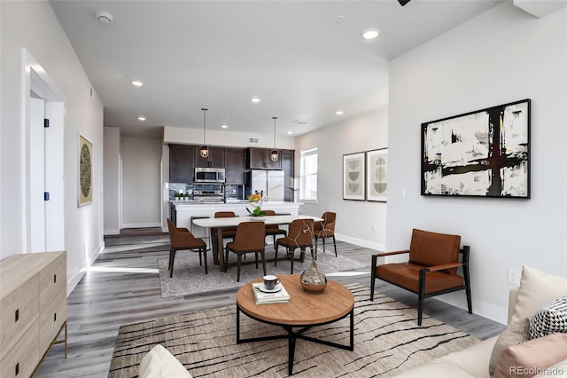 living room with dark hardwood / wood-style flooring