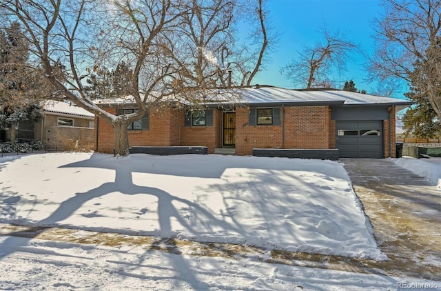 ranch-style house featuring a garage