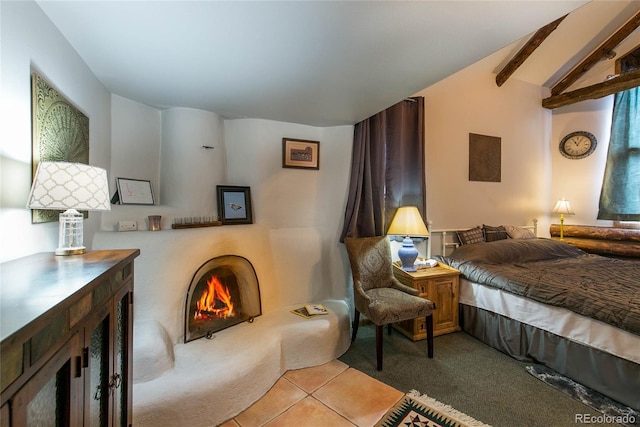 bedroom with vaulted ceiling with beams and light carpet