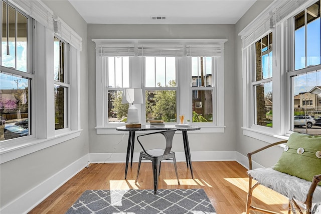 sunroom featuring visible vents
