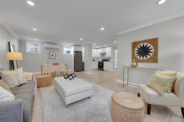 living area featuring recessed lighting, ornamental molding, a wall unit AC, and light wood-style flooring