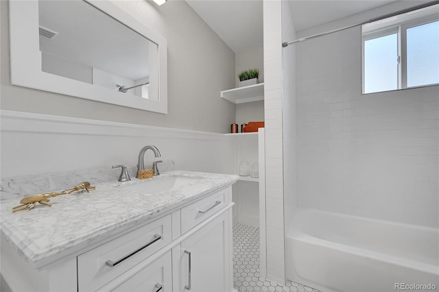 full bath with shower / washtub combination, vanity, tile patterned floors, and visible vents