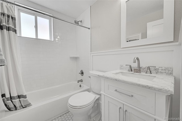 full bath with vanity, shower / bath combo, and toilet