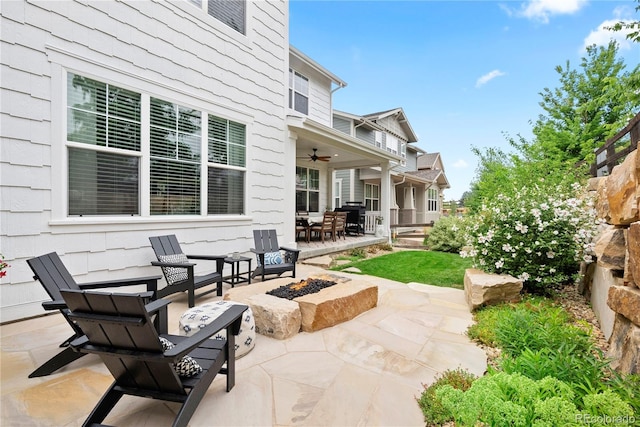 2027 Vallejo Loop, Broomfield, CO 80023 - view of patio with an outdoor fire pit, a ceiling fan, and outdoor dining space