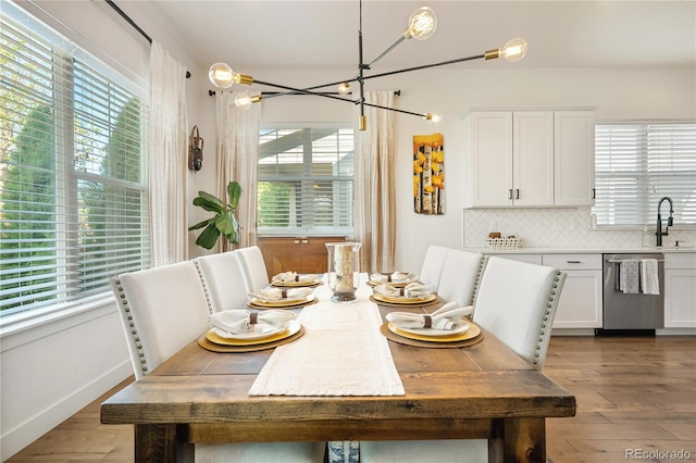 2027 Vallejo Loop, Broomfield, CO 80023 - dining space with plenty of natural light, wood finished floors, a chandelier, and baseboards