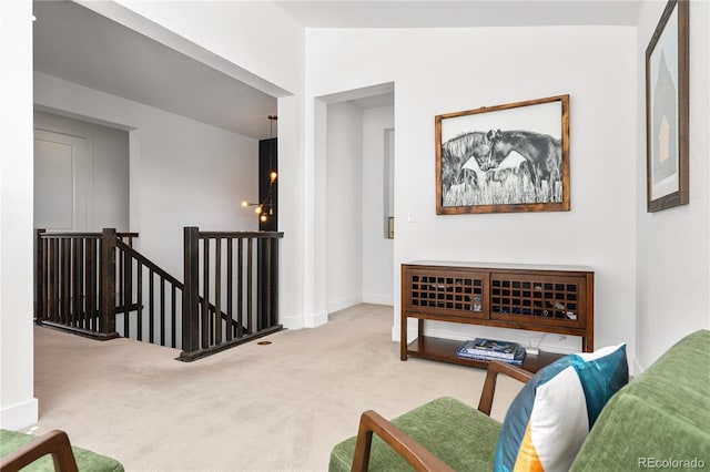 2027 Vallejo Loop, Broomfield, CO 80023 - sitting room featuring an upstairs landing, carpet floors, and baseboards