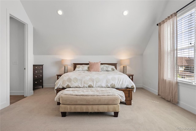 2027 Vallejo Loop, Broomfield, CO 80023 - bedroom with light colored carpet, vaulted ceiling, baseboards, and recessed lighting