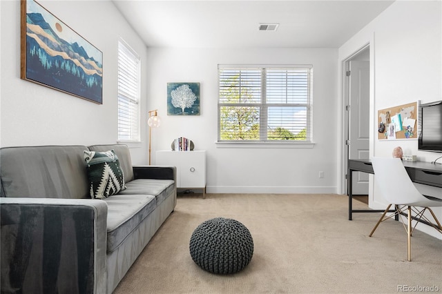 2027 Vallejo Loop, Broomfield, CO 80023 - living room with light carpet, a desk, and baseboards
