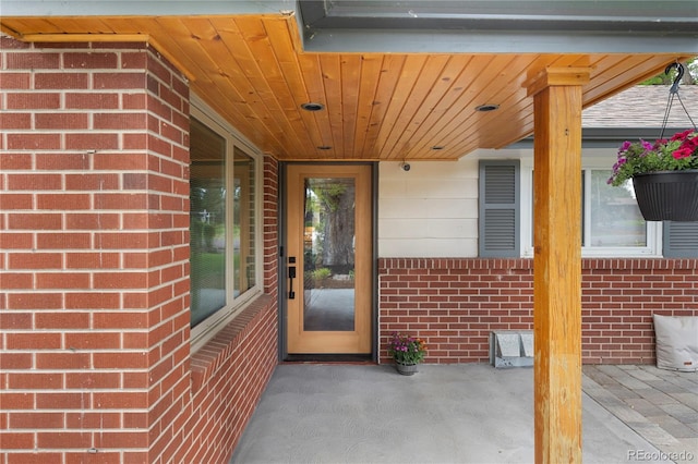 entrance to property with brick siding