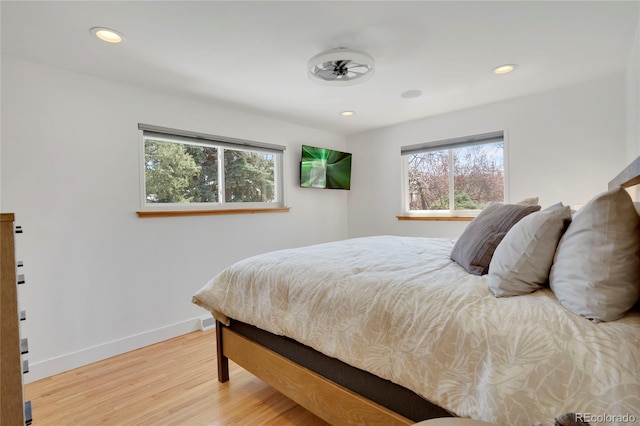 bedroom featuring recessed lighting, baseboards, and wood finished floors