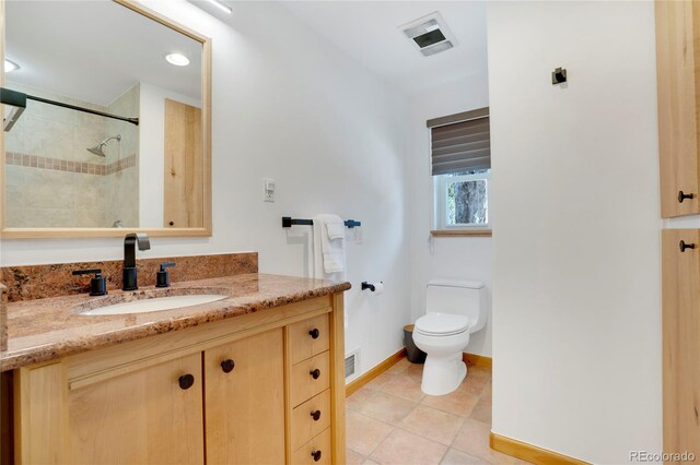 full bathroom with visible vents, baseboards, toilet, vanity, and tile patterned flooring