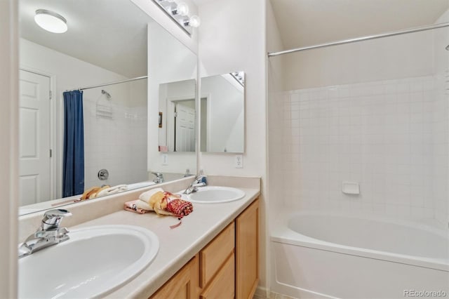 full bathroom with shower / tub combo, a sink, and double vanity