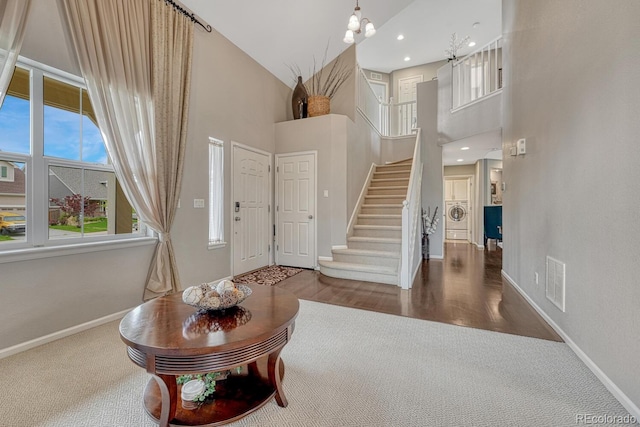 5625 S Buchanan St, Aurora, CO 80016 - entryway with a high ceiling, stairs, baseboards, carpet, and recessed lighting