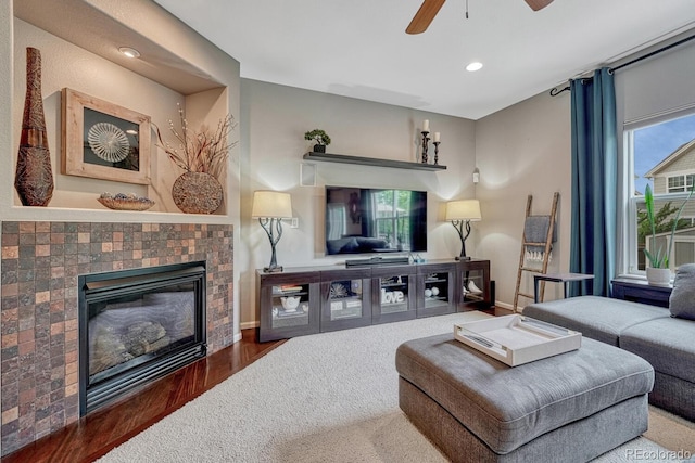 5625 S Buchanan St, Aurora, CO 80016 - living area with ceiling fan, wood finished floors, a glass covered fireplace, recessed lighting, and baseboards