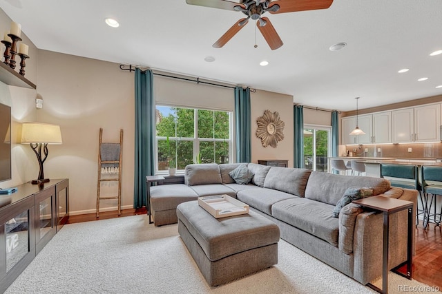 5625 S Buchanan St, Aurora, CO 80016 - living area with recessed lighting, ceiling fan, light wood finished floors, and baseboards