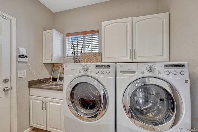 5625 S Buchanan St, Aurora, CO 80016 - laundry room featuring separate washer and dryer and cabinet space
