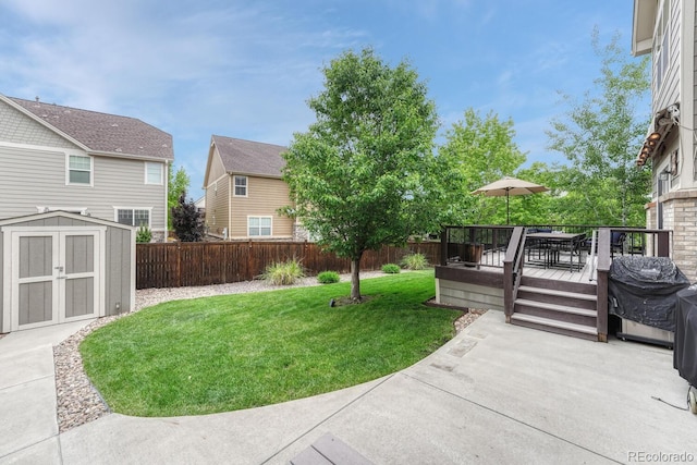 5625 S Buchanan St, Aurora, CO 80016 - view of yard with a wooden deck, outdoor dining space, and a patio area