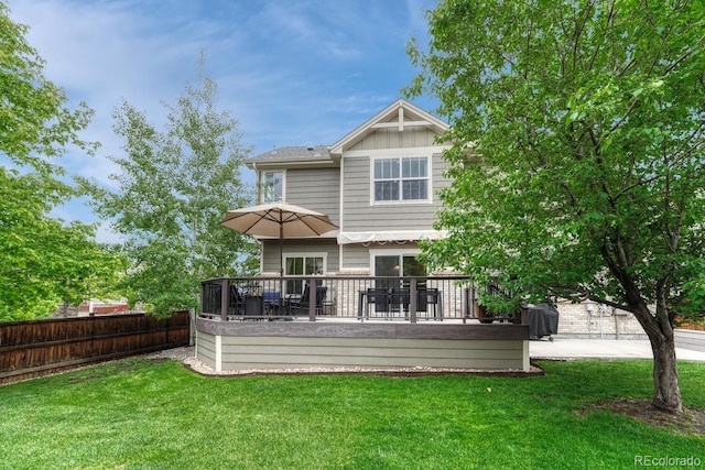 5625 S Buchanan St, Aurora, CO 80016 - back of property with a deck, board and batten siding, and outdoor dining space