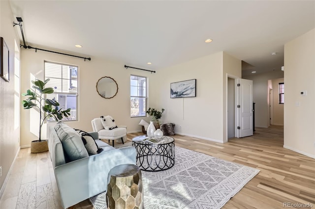 living room with light hardwood / wood-style floors