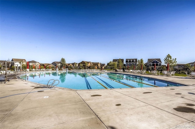 view of swimming pool featuring a patio area