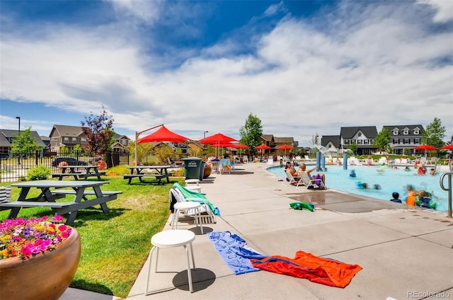 surrounding community featuring a patio area and a lawn