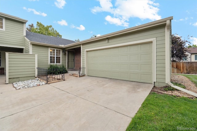 14333 E Warren Pl, Aurora, CO 80014 - ranch-style house featuring an attached garage and concrete driveway