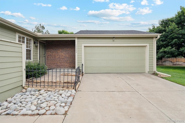 14333 E Warren Pl, Aurora, CO 80014 - garage featuring driveway