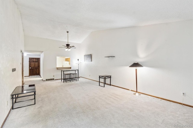 14333 E Warren Pl, Aurora, CO 80014 - carpeted living room with vaulted ceiling, ceiling fan, and baseboards