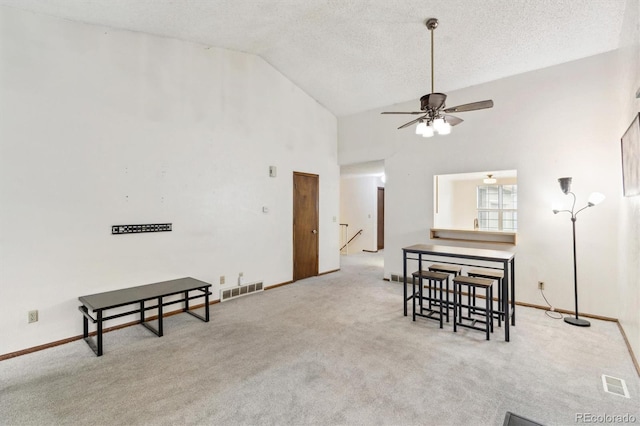 14333 E Warren Pl, Aurora, CO 80014 - carpeted dining space with ceiling fan, high vaulted ceiling, a textured ceiling, and baseboards