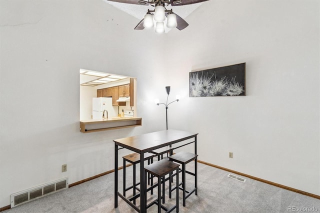 14333 E Warren Pl, Aurora, CO 80014 - dining area with carpet floors, a ceiling fan, and baseboards
