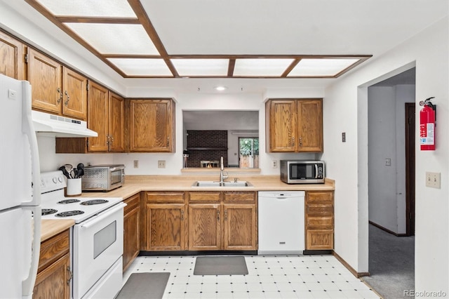 14333 E Warren Pl, Aurora, CO 80014 - kitchen featuring white appliances, under cabinet range hood, a sink, and light countertops