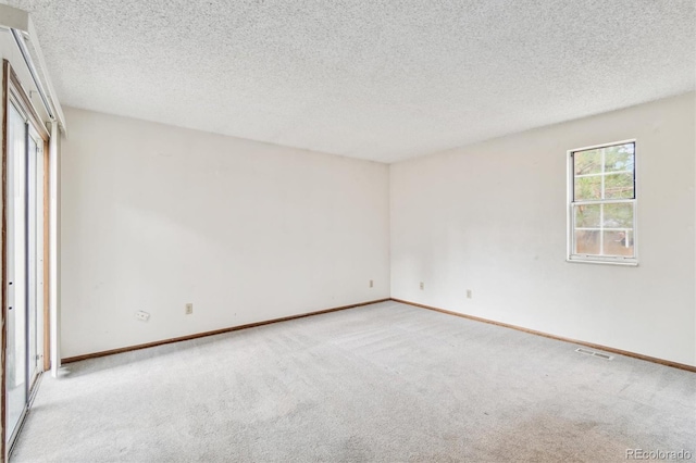 14333 E Warren Pl, Aurora, CO 80014 - unfurnished bedroom with carpet flooring, a textured ceiling, and baseboards