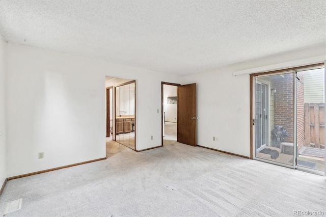 14333 E Warren Pl, Aurora, CO 80014 - empty room featuring carpet, a textured ceiling, and baseboards