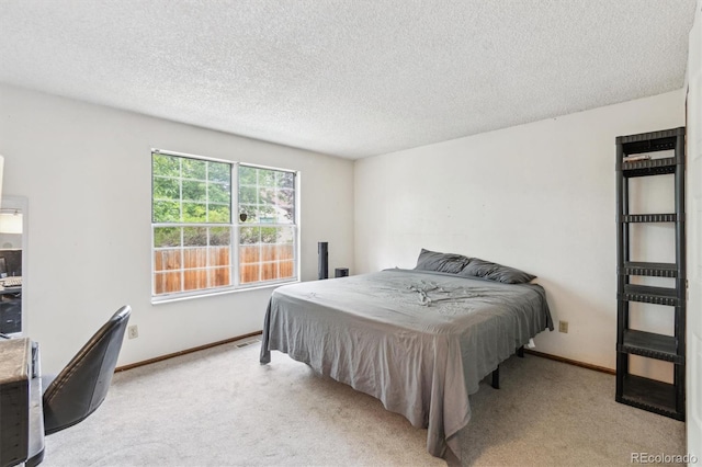 14333 E Warren Pl, Aurora, CO 80014 - carpeted bedroom with a textured ceiling and baseboards