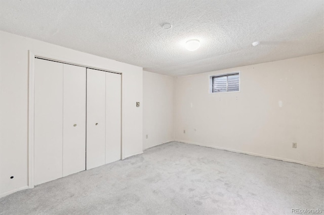 14333 E Warren Pl, Aurora, CO 80014 - unfurnished bedroom with light carpet, a textured ceiling, and a closet